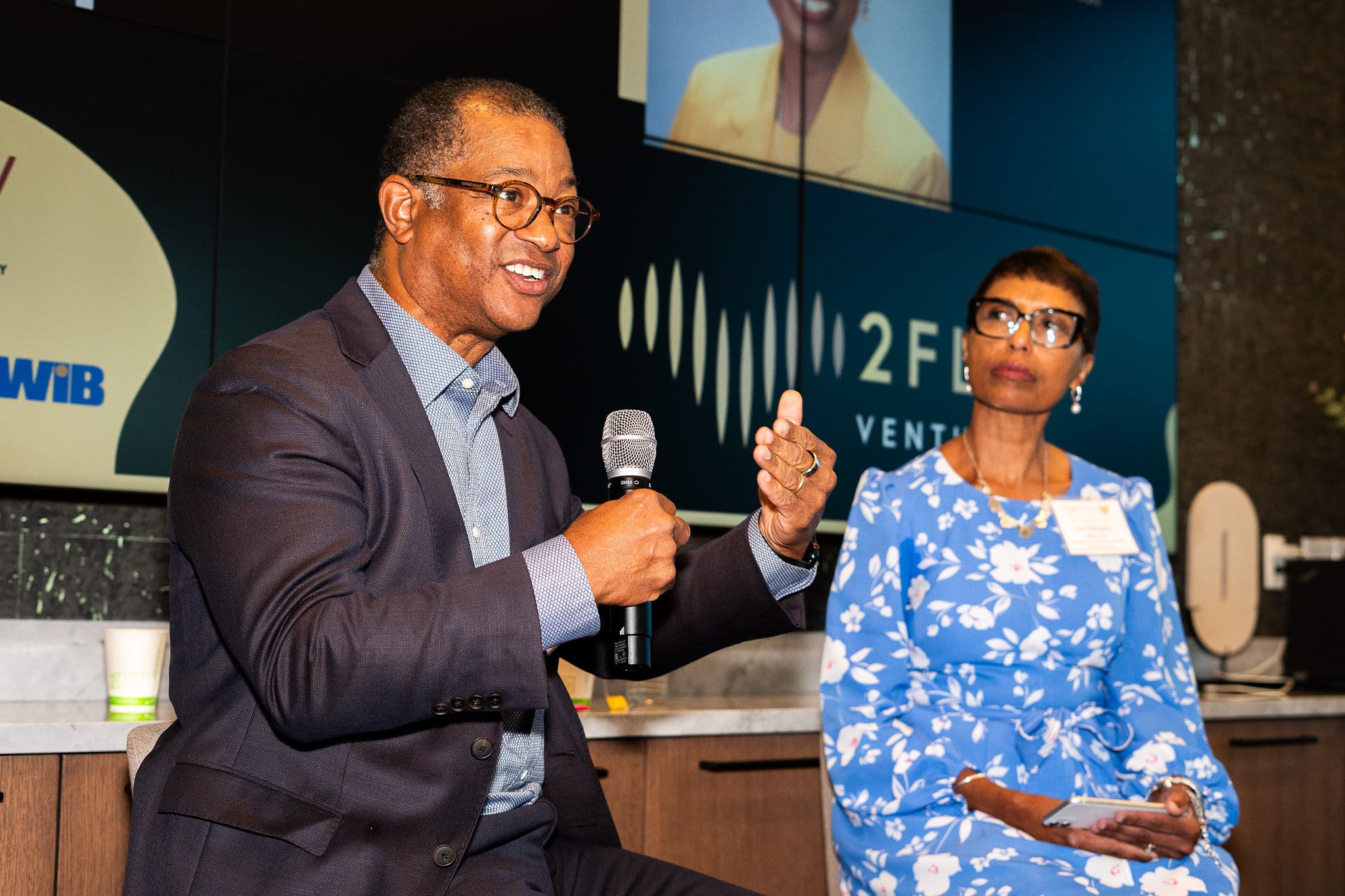 Speaker presenting at 2Flo Ventures event